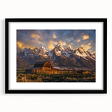 Abstract art print of Wyoming's Grand Tetons in vibrant colors on a large black framed canvas, ideal for living room decor.