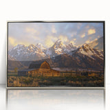 Mid-century modernist acrylic print of the Grand Tetons in muted earth tones, framed in silver.
