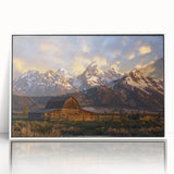 Acrylic print of Grand Tetons scenery in muted natural tones, framed in white, suitable for modern nursery decor.