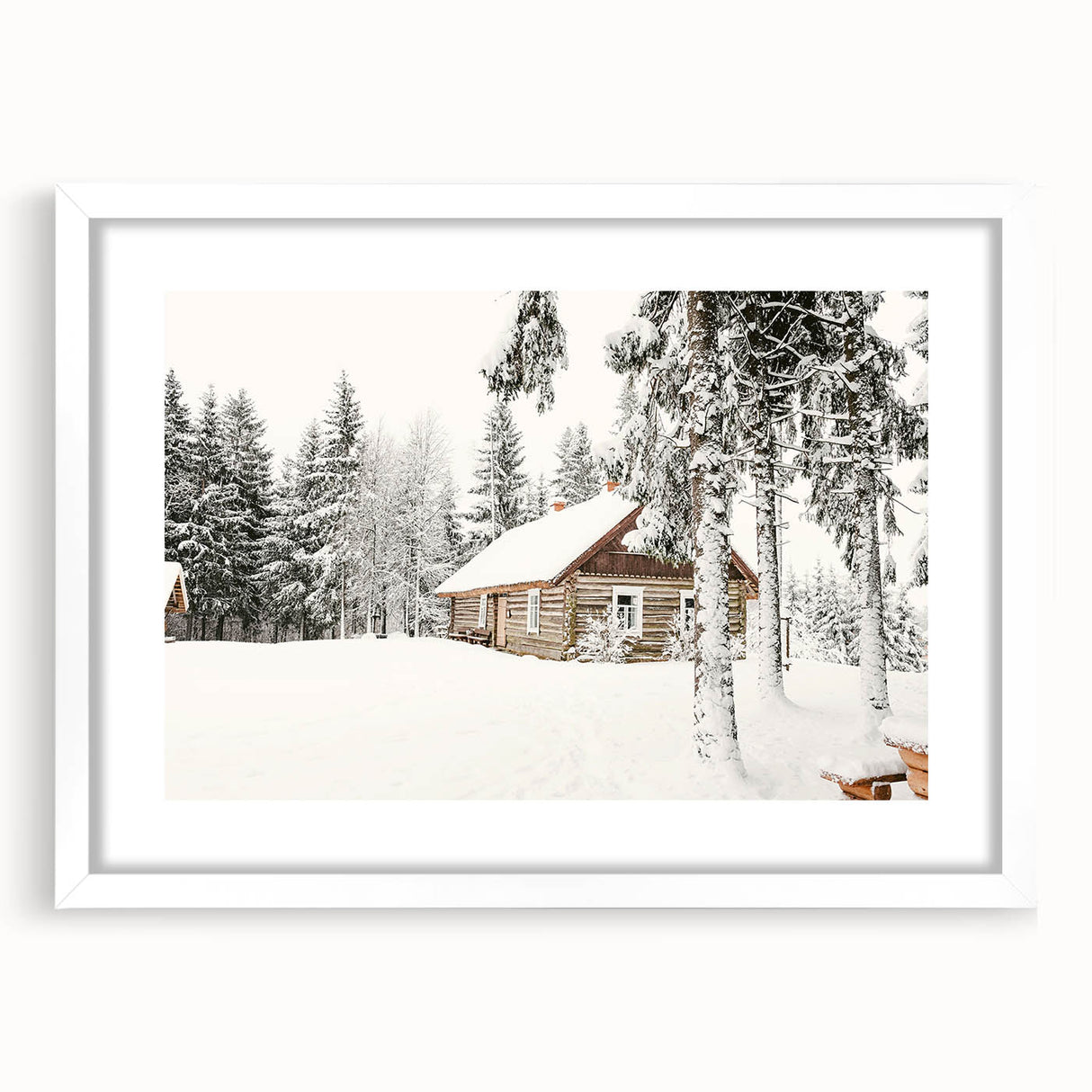 Abstract art print depicting a winter scene in muted blue and white tones on a framed canvas.