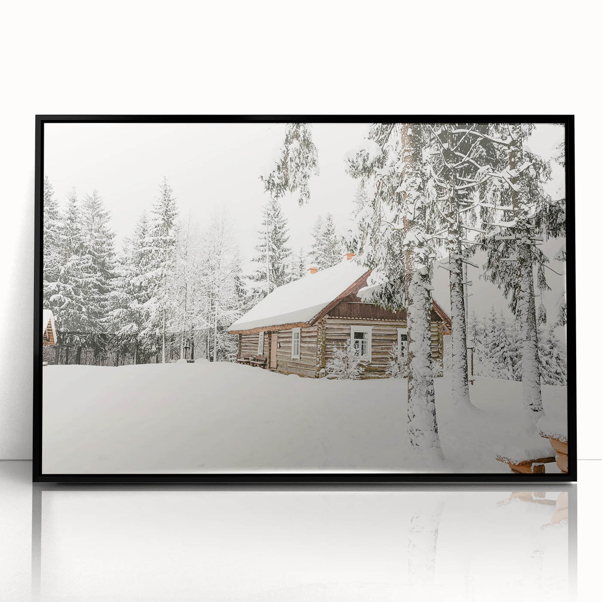 Large abstract wall art depicting a winter scene in muted blue and white tones on framed acrylic.