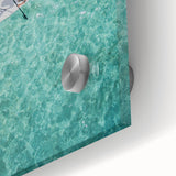 Large abstract wall art in vibrant orange and blue tones on acrylic glass.