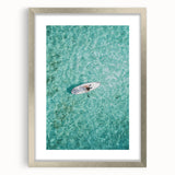 Textured abstract art print in silver frame, featuring swirling gray patterns, ideal for modern bedroom decor.