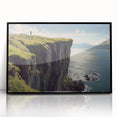 Framed acrylic artwork depicting dramatic cliffs with rich textures and vibrant colors, set against a sleek black frame, ideal for modern interior decor.