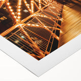 Rolled canvas showcasing a vibrant landscape bridge design with rich colors and intricate details, elegantly presented in a durable cardboard tube for safe storage and transport.