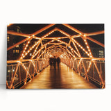 Landscape canvas print depicting a serene bridge scene with lush greenery and a clear blue sky, perfect for home decor or art collectors. This high-quality stretched canvas adds a tranquil touch to any space.