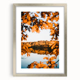 Textured abstract art print in warm autumn hues on a framed canvas, suitable for enhancing a bedroom ambiance.