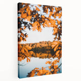 Large art depicting a fall landscape scene on stretched canvas, featuring warm orange and red tones.