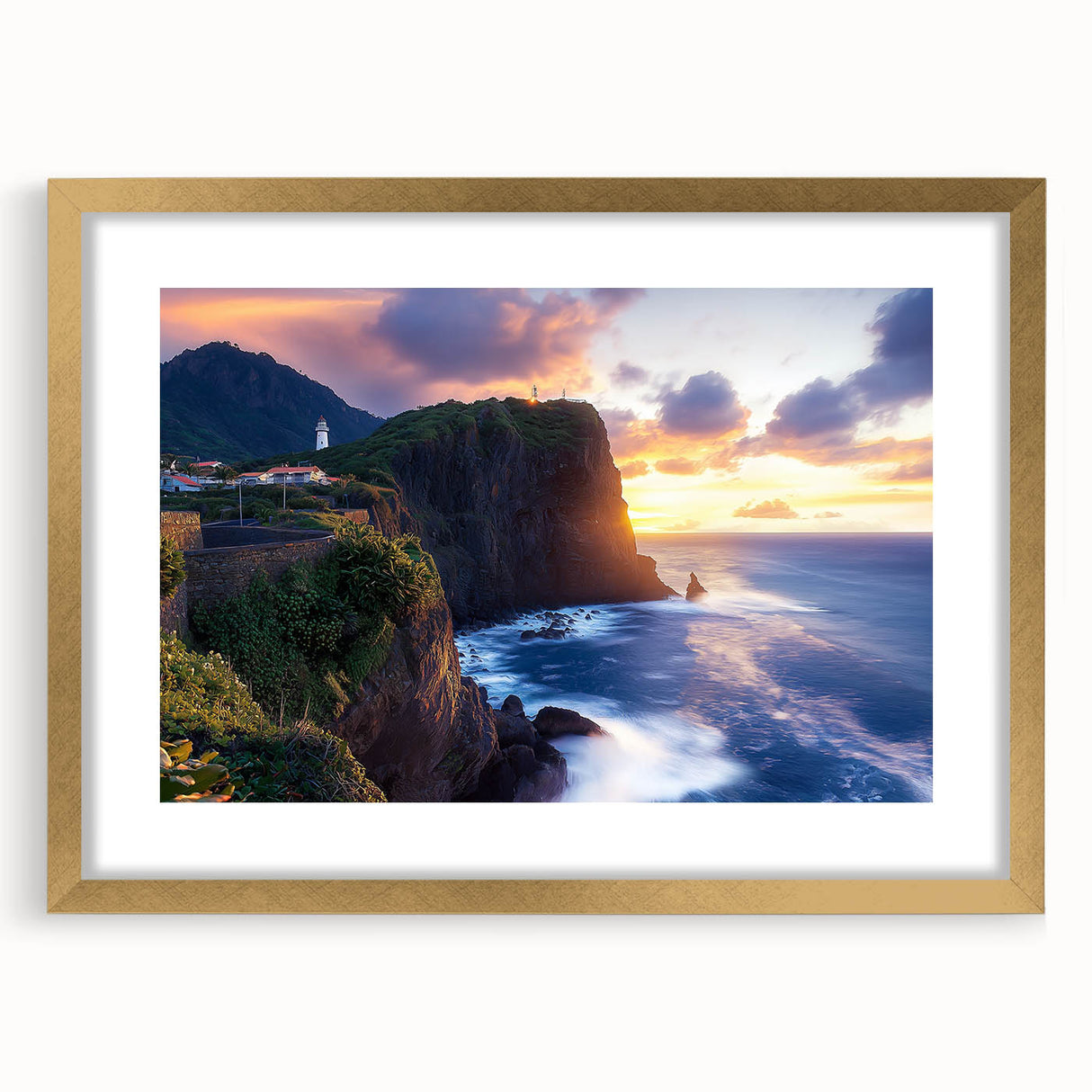 Framed landscape artwork depicting majestic cliffs with a gold matting, perfect for enhancing home decor. This elegant piece adds sophistication to any room.