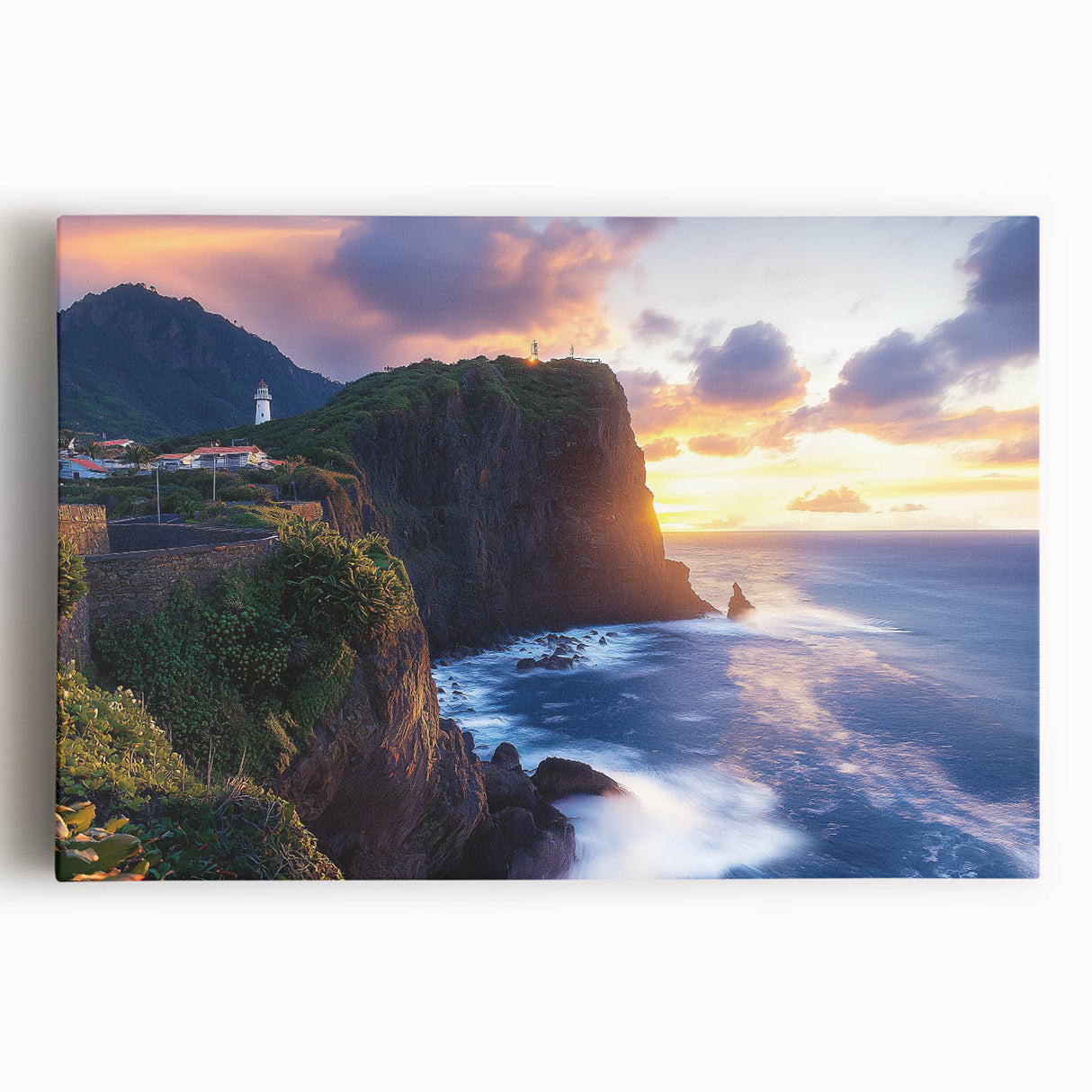 Stretched canvas artwork showcasing a breathtaking landscape of rugged cliffs against a vibrant sunset, perfect for enhancing home decor with nature's beauty.