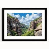 Framed landscape artwork showcasing dramatic cliffs in vibrant colors with a sleek black matting, perfect for enhancing modern home decor or office spaces.