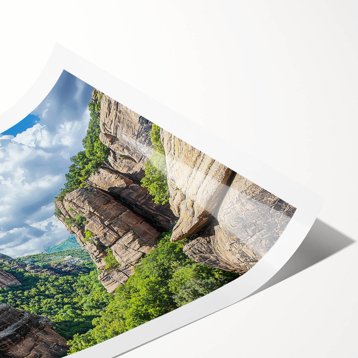 Stunning landscape print of vibrant cliffs in warm hues, showcasing intricate textures and details, rolled and ready for display in a protective tube.