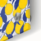 Close-up of large abstract wall art featuring assorted fruits in vibrant colors on acrylic glass.