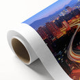 Rolled canvas showcasing a vibrant landscape bridge design, beautifully textured, and securely packaged in a durable cardboard tube for optimal protection during shipping.