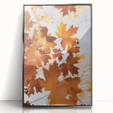 Mid-century modernist art depicting an autumnal scene in muted orange and brown tones, framed in silver acrylic.