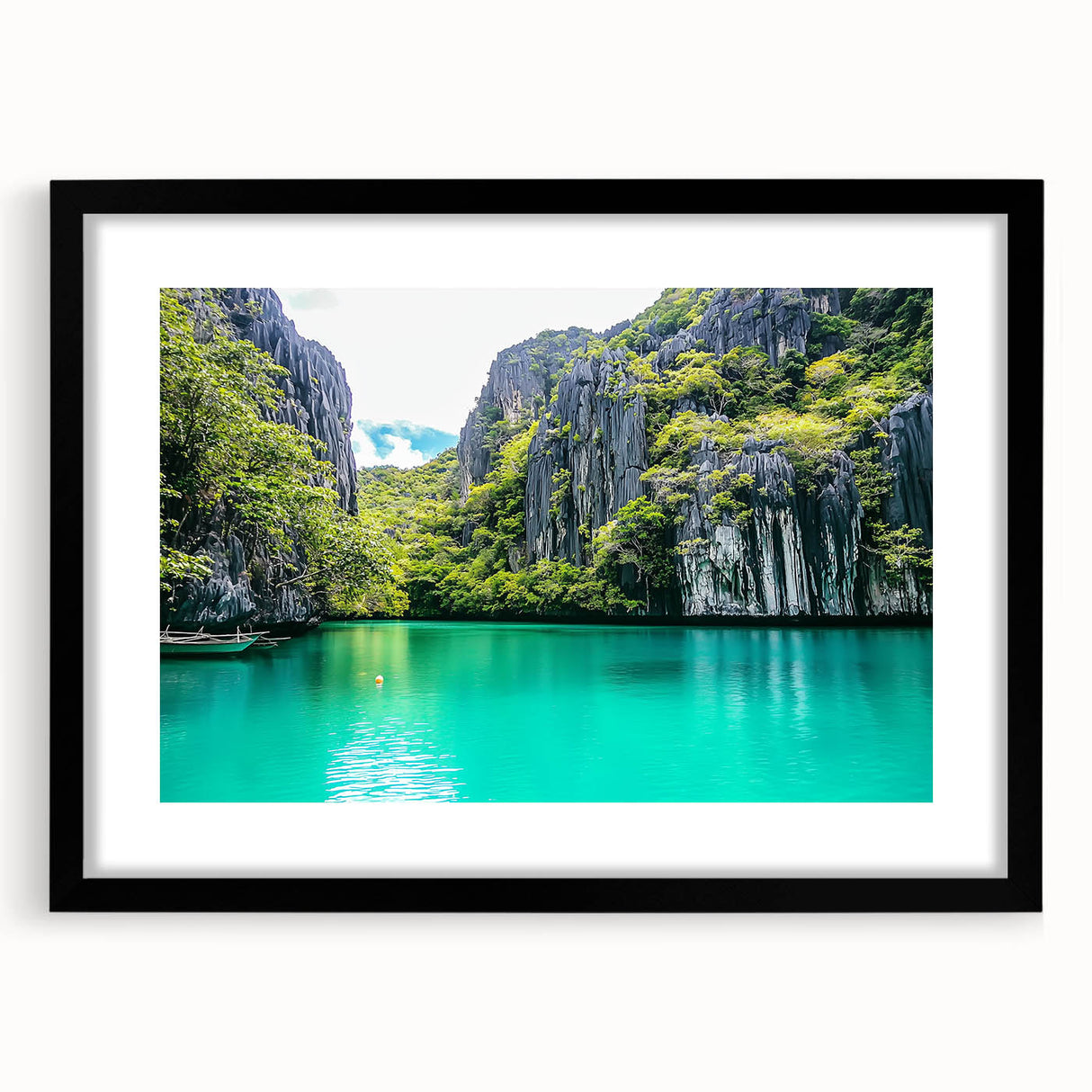 Framed landscape artwork showcasing majestic cliffs in a black mat, ideal for modern home decor. The piece emphasizes natural beauty and depth.