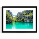 Framed landscape artwork showcasing majestic cliffs in a black mat, ideal for modern home decor. The piece emphasizes natural beauty and depth.