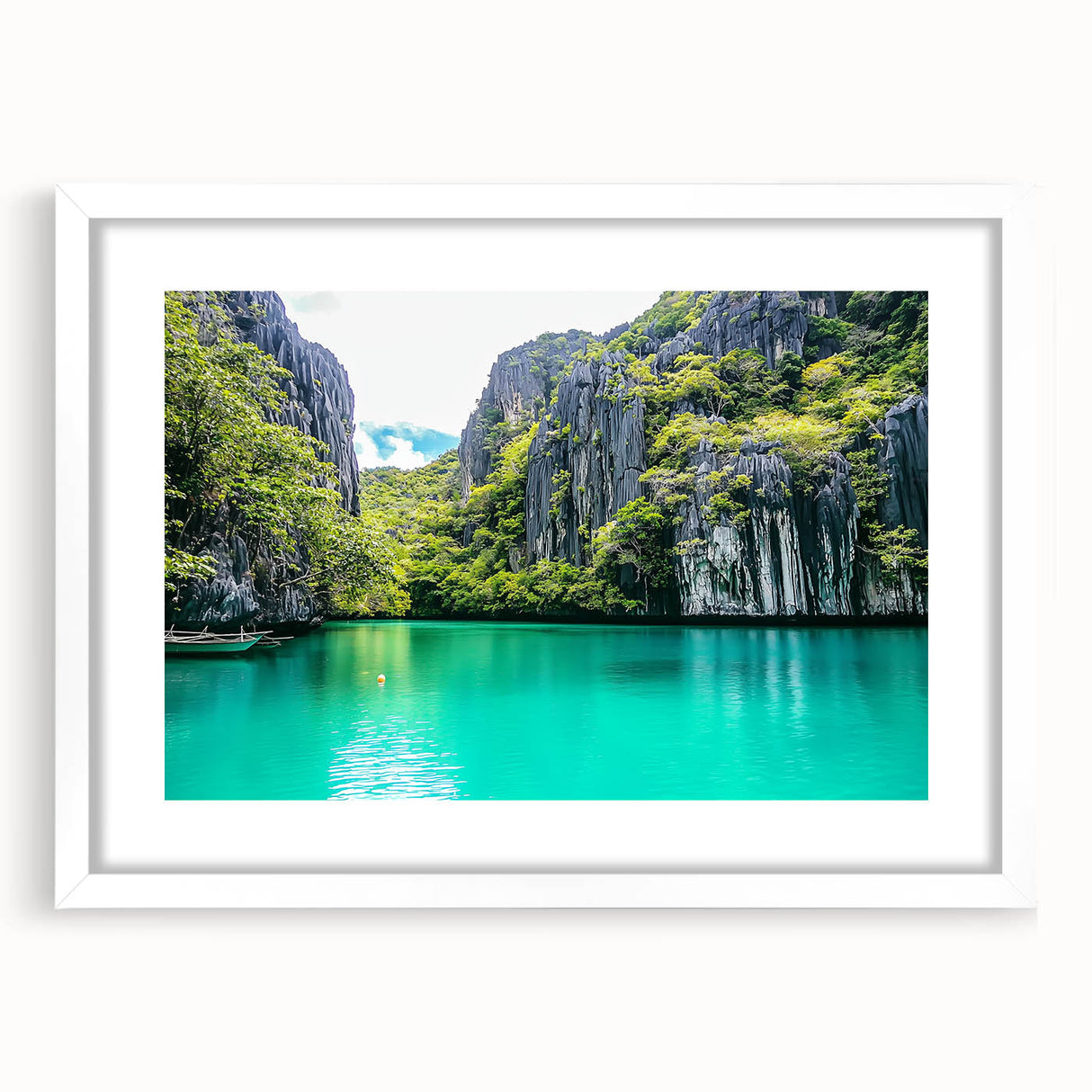 Framed landscape artwork depicting dramatic cliffs and serene skies, showcasing a white mat for an elegant presentation, ideal for home decor or office spaces.