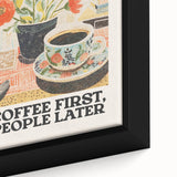 Close-up of black wall art featuring colorful, textured food and drink motifs on a framed canvas.