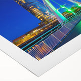 Rolled canvas showcasing a vibrant landscape bridge design, featuring rich colors and intricate details, securely packaged in a protective cardboard tube. Perfect for home decor.