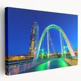 Landscape canvas print showcasing a serene bridge scene, featuring lush greenery and a tranquil waterway, perfect for home decor or office spaces. The vibrant colors and detailed artistry enhance any room's ambiance.