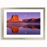 Silver-framed landscape artwork showcasing dramatic cliffs, elegantly matted for a sophisticated look, perfect for enhancing contemporary home decor.
