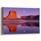 Framed canvas artwork depicting a scenic landscape with dramatic cliffs and rich golden hues, showcasing a side view that enhances its elegance. Ideal for home decor.