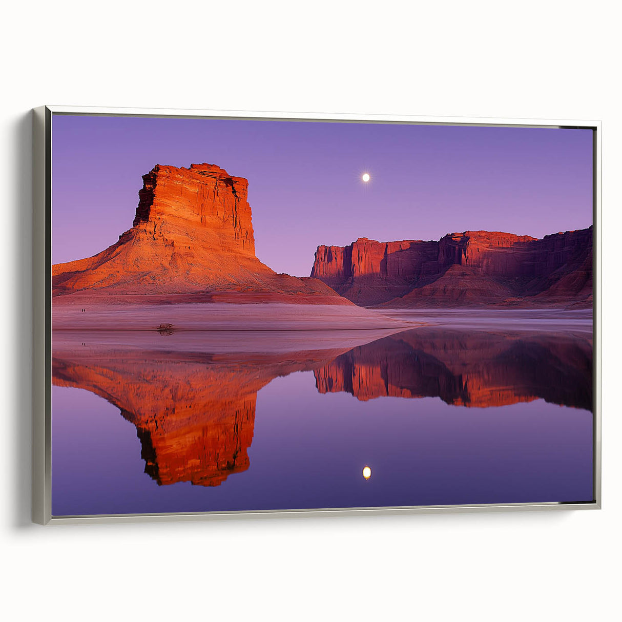 Framed canvas artwork depicting a serene landscape with cliffs, featuring a silver frame and side view, perfect for enhancing home decor and bringing nature indoors.