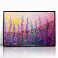 Framed abstract floral wall art with vibrant colors, displayed in a sleek black frame, perfect for modern home decor. Ideal for adding elegance to any room.