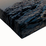 Close-up of a stretched canvas featuring an abstract landscape design with vibrant colors and textured details, ideal for modern home decor.