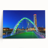 Stretched canvas artwork depicting a serene landscape featuring a bridge over a tranquil body of water, ideal for home decor and nature enthusiasts. The vibrant colors and intricate details enhance any living space's ambiance, making it a perfect gift for art lovers.