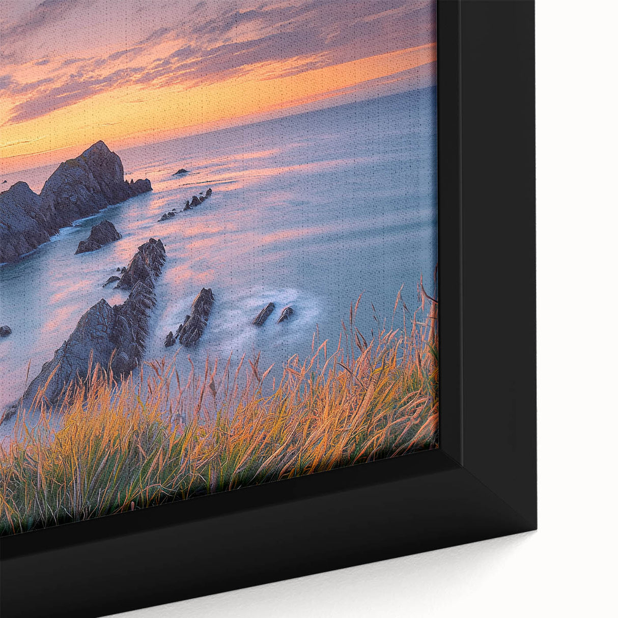 Close-up of a beautiful framed canvas artwork depicting dramatic cliffs in a vibrant landscape, showcasing rich colors and intricate textures that enhance any decor.