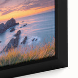 Close-up of a beautiful framed canvas artwork depicting dramatic cliffs in a vibrant landscape, showcasing rich colors and intricate textures that enhance any decor.