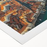 Rolled canvas showcasing a vibrant landscape bridge design, featuring rich colors and intricate details, securely packaged in a protective cardboard tube for artwork preservation.