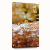 Large abstract wall art on acrylic glass depicting a fall scene in earthy orange and brown tones.
