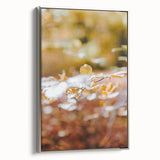 Framed canvas of a vintage landscape painting depicting autumn trees in vibrant red and orange colors.