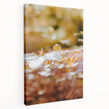 Side view of a large stretched canvas depicting an abstract fall scene in warm orange and red tones.