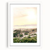 Abstract art print depicting summer season in vibrant orange and yellow tones, framed in white.