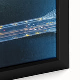 Close-up of a framed canvas print depicting a serene landscape with a bridge, showcasing vibrant colors and intricate details, ideal for home decor enhancement.