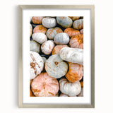 Textured abstract art print in warm autumn hues on a silver-framed canvas, ideal for bedroom art.