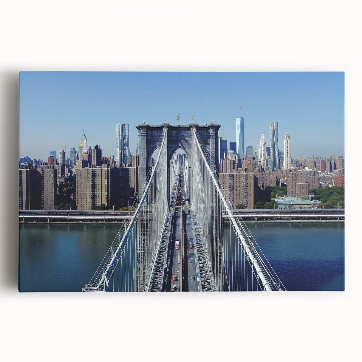 Landscape canvas print showcasing a vibrant bridge over a serene river, featuring lush greenery and a clear blue sky, ideal for enhancing home decor.