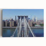 Landscape canvas print showcasing a vibrant bridge over a serene river, featuring lush greenery and a clear blue sky, ideal for enhancing home decor.