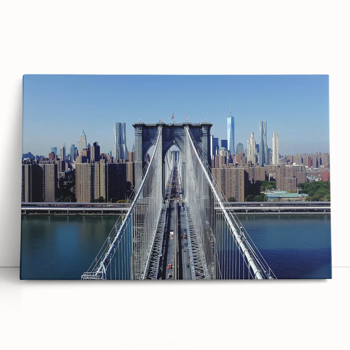 Stretched canvas artwork depicting a serene landscape featuring a bridge over a tranquil river, ideal for home decor. The vibrant colors and detailed textures enhance any room's ambiance.