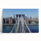 Stretched canvas artwork depicting a serene landscape featuring a bridge over a tranquil river, ideal for home decor. The vibrant colors and detailed textures enhance any room's ambiance.