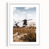 Abstract art print featuring swirling autumnal colors in a white frame, ideal for dining room or bedroom decor.