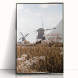 Mid-century modernist art depicting autumn trees in orange and brown tones on a silver-framed acrylic print.