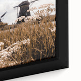 Close-up of a black framed canvas featuring textured, colorful abstract design, ideal for living room decor.