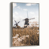 Framed canvas depicting a vintage landscape painting of autumn trees with muted earth tones, ideal for living room decor.