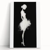 Abstract figurative stretched canvas artwork leaning against a neutral wall, showcasing vibrant colors and dynamic shapes, perfect for modern home decor.