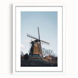 Abstract art print featuring swirling autumnal hues on a white framed canvas, ideal for dining room decor.